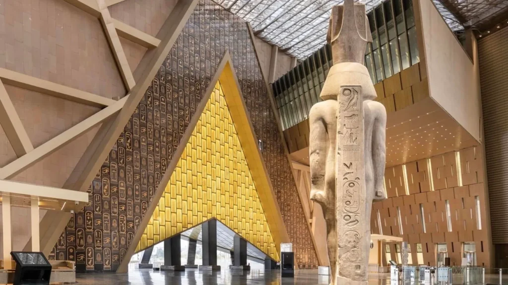 The Grand Egyptian Museum, a modern building near the Pyramids of Giza, showcasing ancient Egyptian artifacts and treasures, including those of Tutankhamun.