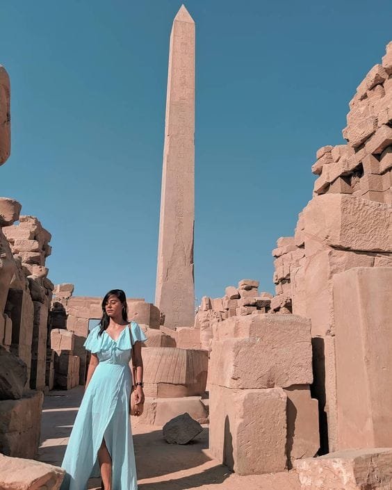 Obelisk in Luxor with a visitor, captured with Egypt Tour Magic.