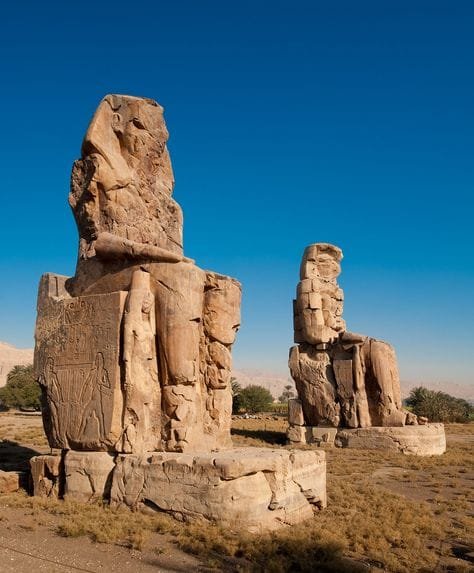 Colossi of Memnon, iconic ancient statues in Luxor, captured with Egypt Tour Magic.