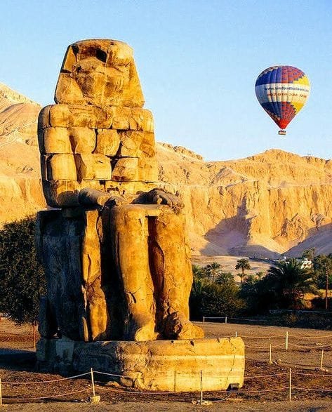 The Colossi of Memnon, ancient statues in Luxor, captured with Egypt Tour Magic.
