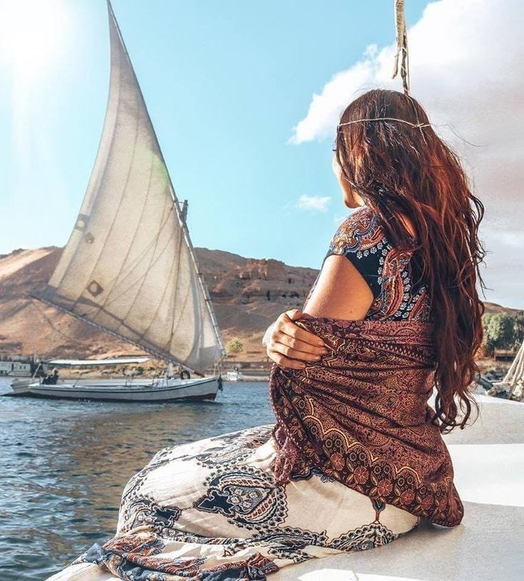 Visitor relaxing on a boat along the Nile River, captured with Egypt Tour Magic.