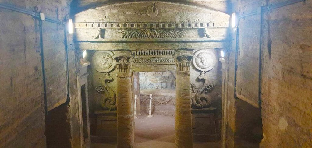 The Catacombs of Kom El Shoqafa in Alexandria, highlighted by Egypt Tour Magic, featuring a fusion of Greco-Roman and Egyptian art.