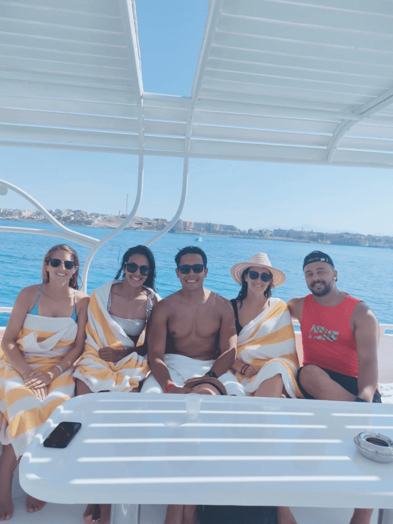 Manager and four visitors on a boat in the Red Sea with Egypt Tour Magic.