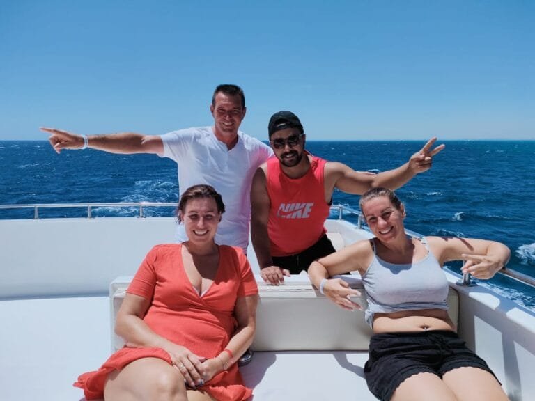 Manager and three visitors on a boat in the Red Sea with Egypt Tour Magic.