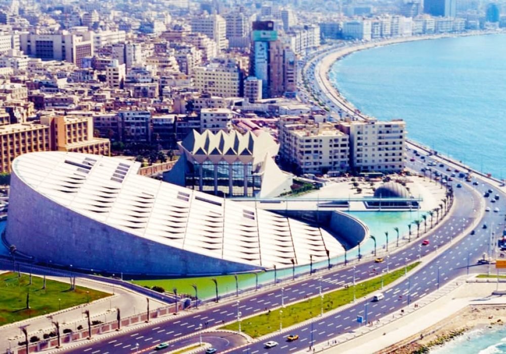 Modern Bibliotheca Alexandrina in Alexandria, Egypt, highlighted by Egypt Tour Magic for its circular design and engraved granite wall.