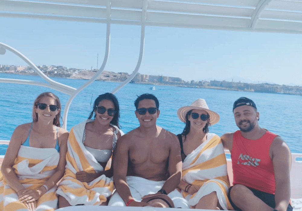 Manager and four visitors on a boat in the Red Sea with Egypt Tour Magic.
