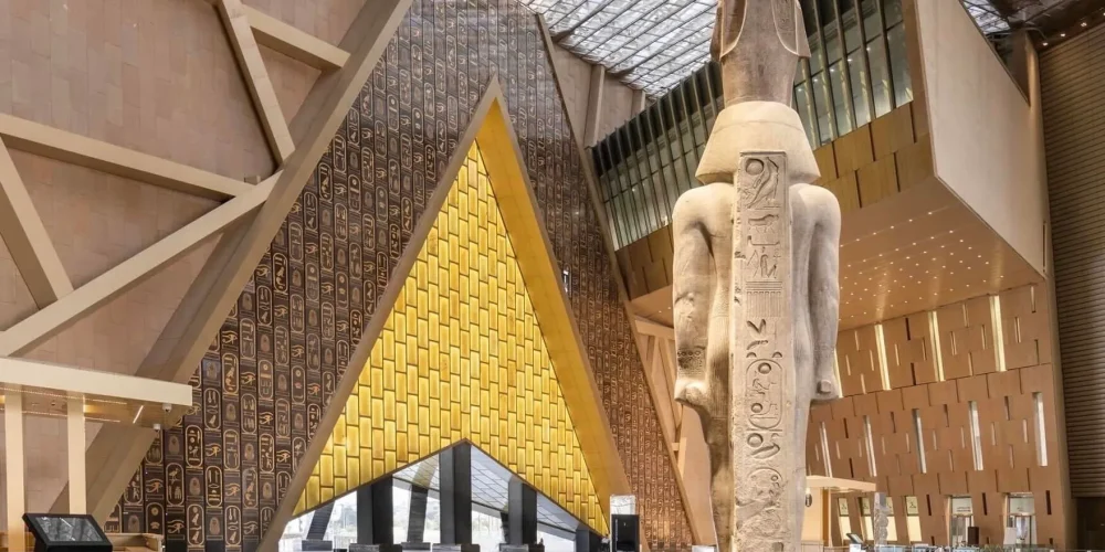 The Grand Egyptian Museum, a modern building near the Pyramids of Giza, showcasing ancient Egyptian artifacts and treasures, including those of Tutankhamun.