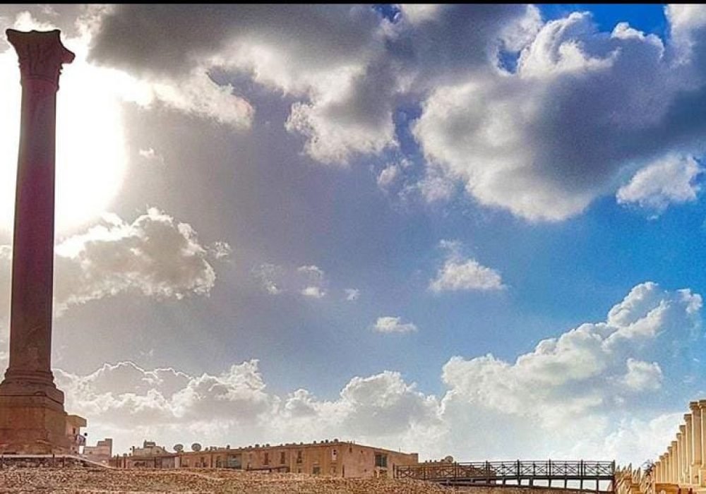 Pompey’s Pillar in Alexandria, highlighted by Egypt Tour Magic, showcasing ancient Roman architecture and grandeur.